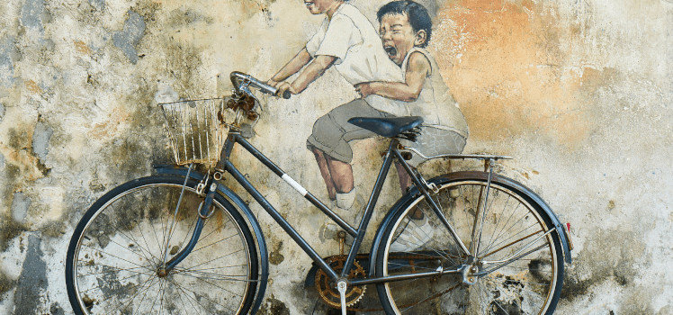 When a child rides an adult bicycle, he or she cannot turn the pedals. 